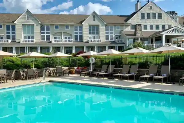 Inn by the Sea beach in Cape Elizabeth, Maine, with sandy dunes and eco-friendly architecture.