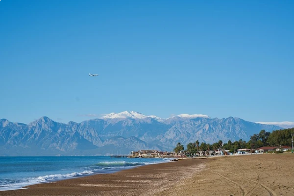 Lara Beach in Antalya with sandy shores, clear waters, and luxury resorts