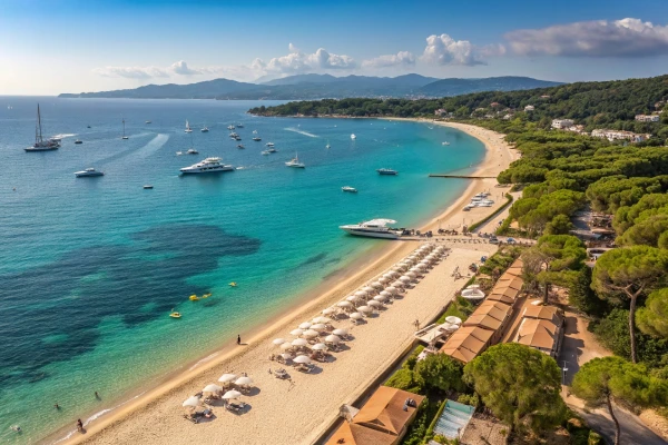 Pampelonne Beach in Saint-Tropez with golden sands, azure waters, and luxury beach clubs