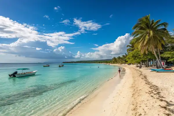 Seven Mile Beach in Jamaica with golden sands, azure waters, and palm trees.