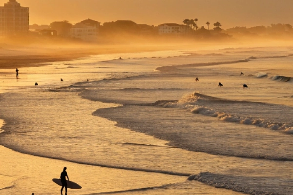 Golden morning light on gentle waves at New Smyrna Beach