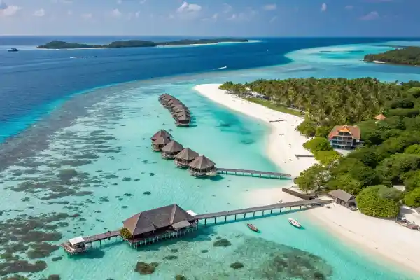 Overwater bungalows in the Maldives with pristine white sands and turquoise waters.